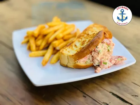 A lobster roll with fries from Anchors Fish & Chips And Seafood Grill in Saratoga.