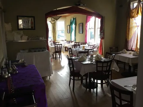 Dining room with set tables at Ark North Indian Cuisine