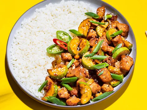Stir-fried chicken with peppers over rice at Wu Liang Ye