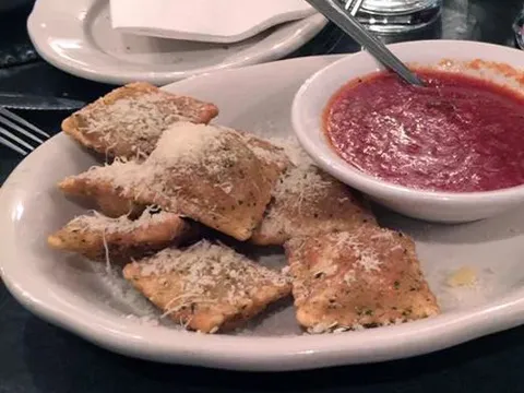 A plate of toasted ravioli with marinara dipping sauce at Cunetto House of Pasta