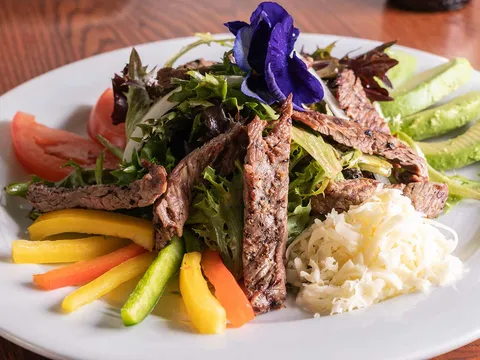 Grilled arrachera steak salad with avocado, peppers and cotija cheese at Blue Agave Club