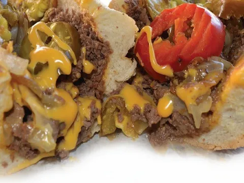 Cheesesteak with peppers and cheese at Jim's Steaks South Street