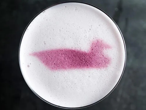 Cocktail with a duck motif in the foam at Decoy