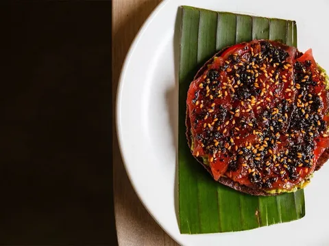 Charred round dish presented on a banana leaf at Oxomoco
