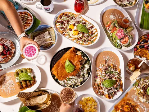 Overhead spread of chilaquiles and Mexican breakfast dishes at Cocina 35