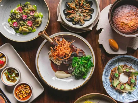 Spread of Moroccan dishes including lamb, mussels, breads and vegetables at Aziza