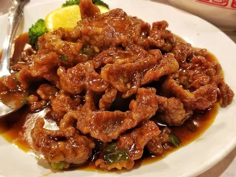 Plate of crispy fried pork in sauce at Lao Sze Chuan