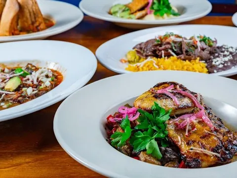 Plated Mexican entrees with rice and black beans at 5 Rabanitos