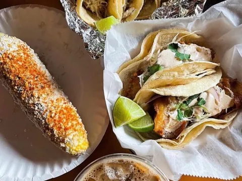 Grilled elote, a basket of fish tacos and an iced horchata cold brew from Mas Tacos Por Favor