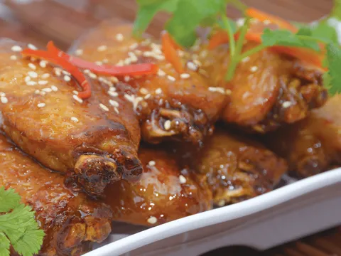 Platter of roast poultry garnished with chili and cilantro at Dragon Beaux