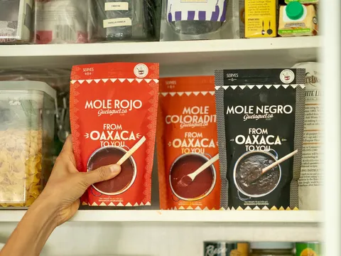 Packages of Guelaguetza mole displayed in the restaurant market