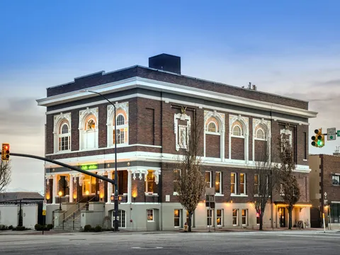 Exterior of the historic brick building housing Caffé Molise at dusk