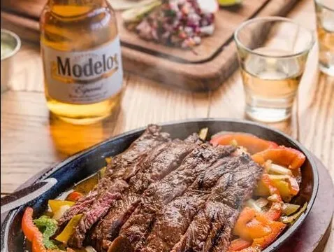 Steak fajitas with peppers and onions served at Los Agaves Santa Barbara