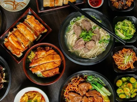 Assortment of noodle, rice, meat and vegetable dishes at A & J Restaurant