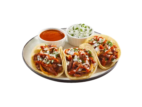Three King Taco al pastor–style tacos on corn tortillas topped with red salsa, onion and cilantro, plated with ramekins of salsa roja and chopped onion-cilantro