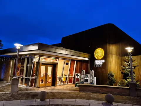 Illuminated entrance of Dough Zone Dumpling House in Portland
