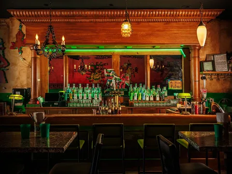 Colorful bar and dining room inside La Diabla Pozole y Mezcal