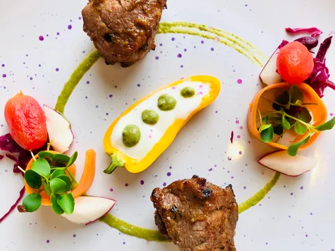 Plated grilled lamb kebab with microgreens, pickled radish and watermelon at Coromandel Cuisine of India, Darien