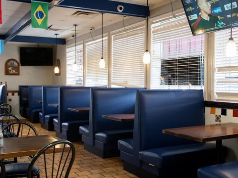 Blue booth seating along a window at Taqueria Mexico 2