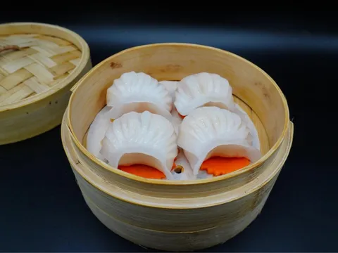 Bamboo steamer of shrimp har gow crystal dumplings at Silk Road